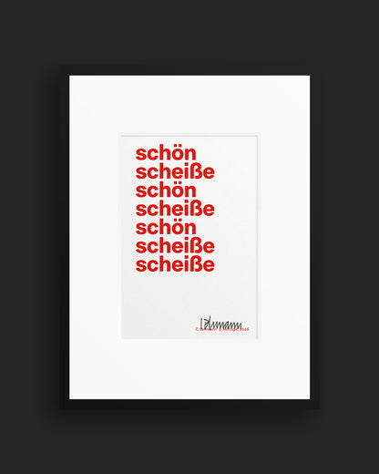 Gerahmter roter Siebdruck »schön scheiße« mit weißem Passepartout und schwarzem Rahmen.
